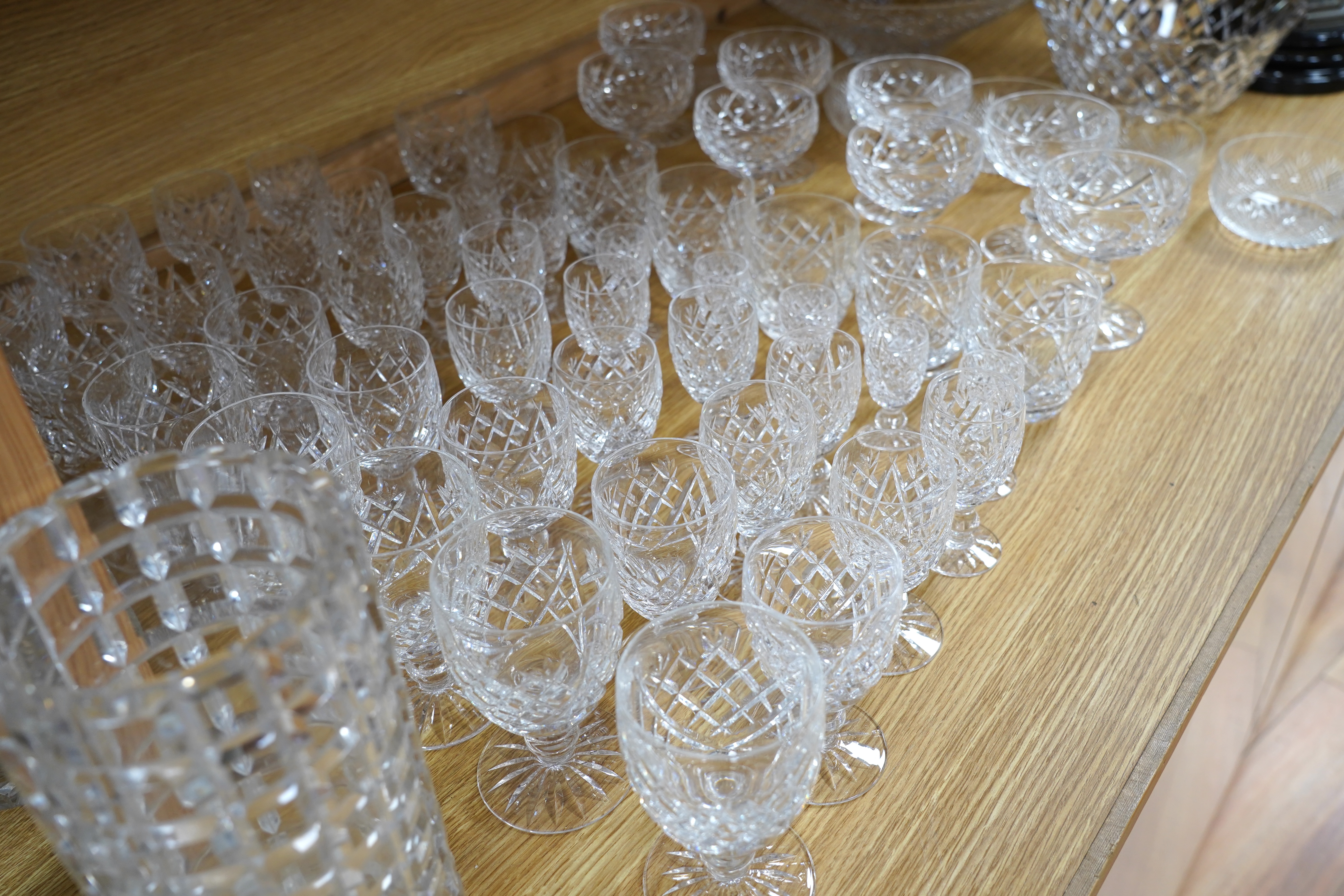 A suite of Waterford drinking glasses in various sizes, including wine glasses, liqueur glasses, champagne glasses, etc. together with glass vases and jugs, etc. (66)